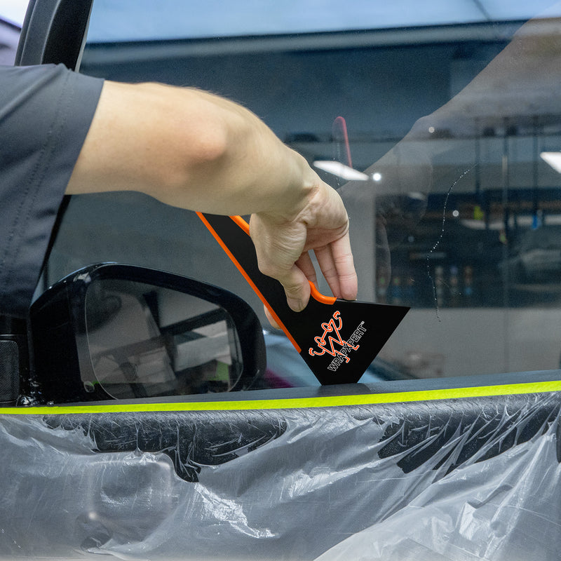 Load image into Gallery viewer, Using wrap tool on car window edge
